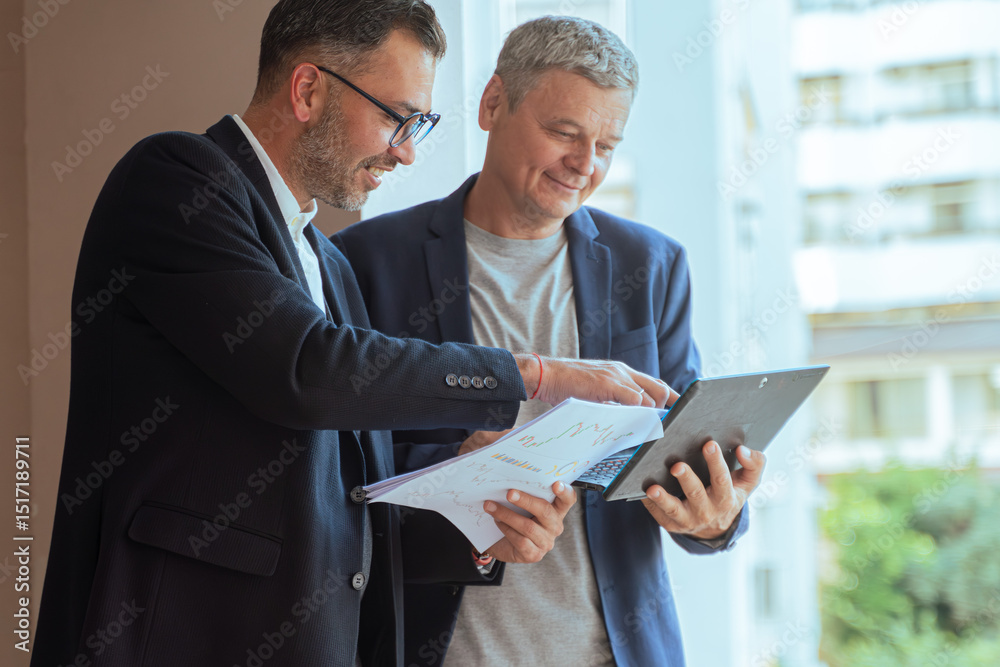 custom made wallpaper toronto digitalA two man businessman Reviewing Documents and Digital Tablet in Modern Office