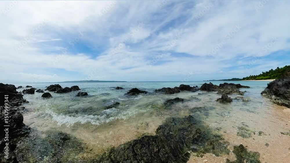 Ocean waves splashing over the rocks in coastal area. Santa Fe, Tablas Island. Romblon, Philippines. Ocean waves splashing over the rocks in coastal area. Santa Fe, Tablas Island. Romblon, Philippines.