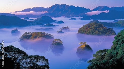 Misty islands rising from a tranquil lake.