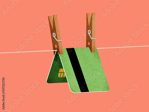 Green bank card clipped with clothespin photo