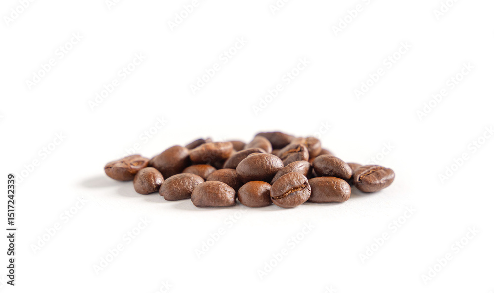 Naklejka premium Coffee beans on white background. Pile of coffee beans. Close up image.