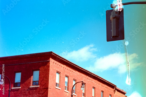 Building against blue sky with damaged film photo