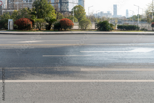 Fototapeta Naklejka Na Ścianę i Meble -  Empty urban road and buildings in the city