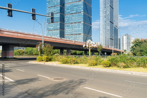 Fototapeta Naklejka Na Ścianę i Meble -  Empty urban road and buildings in the city