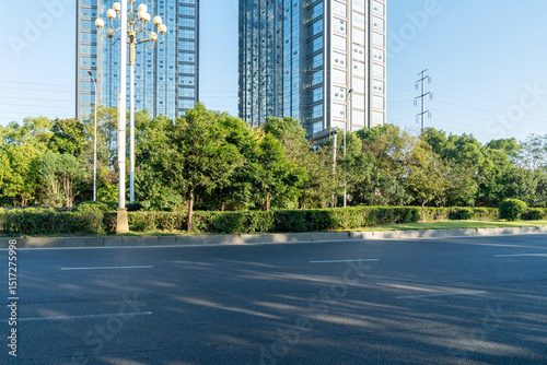Fototapeta Naklejka Na Ścianę i Meble -  Empty urban road and buildings in the city