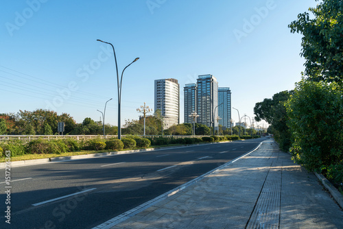Fototapeta Naklejka Na Ścianę i Meble -  Empty urban road and buildings in the city