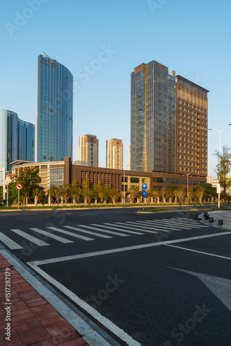 Fototapeta Naklejka Na Ścianę i Meble -  Empty urban road and buildings in the city