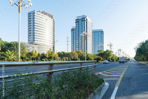 Fototapeta Naklejka Na Ścianę i Meble -  Empty urban road and buildings in the city