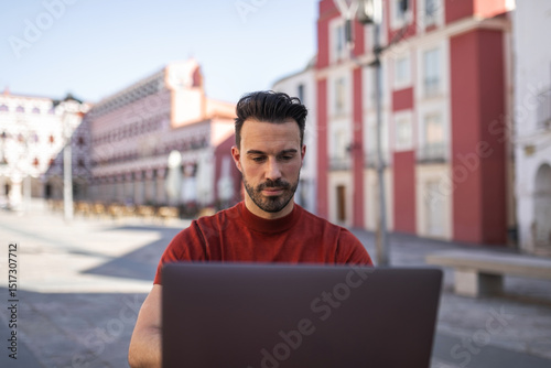 Young man working at outdoor café