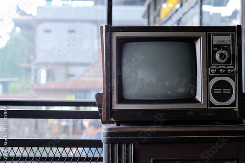 an old tv and retro camera on a rack, with copy space that perfect for illustration