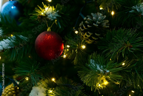 Festive Christmas Tree Close-Up with Glowing Lights and Colorful Baubles on Holiday Eve photo