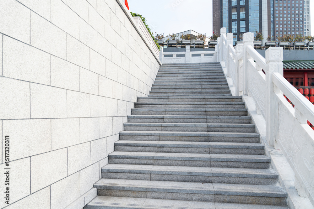Fototapeta premium stairs with handrails on both sides in a park