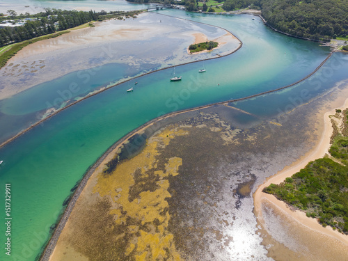 Boats on a winding river estuary 