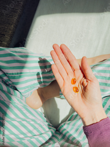 Hand Holding Evening Primrose Oil Capsules