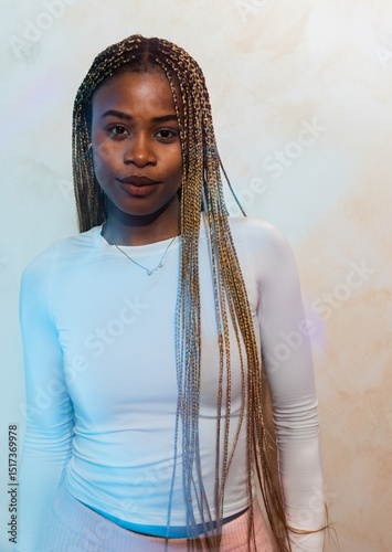 Portrait of a woman in a relaxed pose with braids