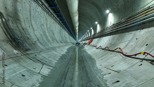 Modern Subway Tunnel with Lighting and Auxiliary Pipes