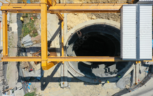 Construction Site including Tunnel Shaft Excavation and Crane photo