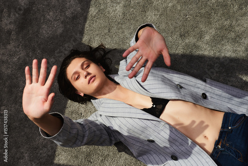 Woman laying on carpet  posing photo