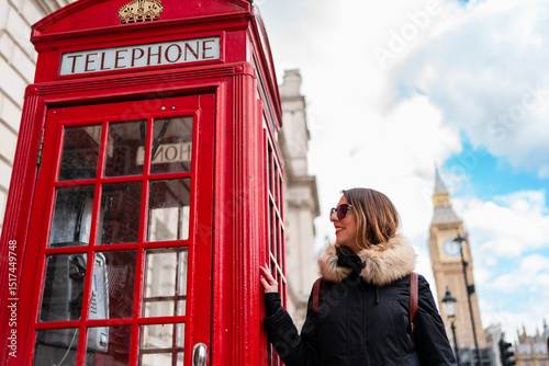 Woman near a Telephone booth in London photo