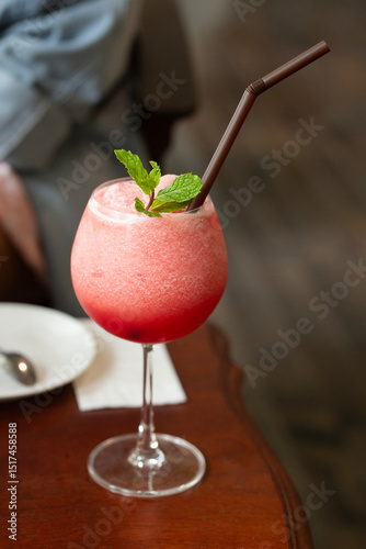 A chilled watermelon smoothie offers a refreshing escape from the heat.