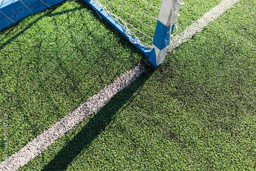 Part of soccer field and gate photo