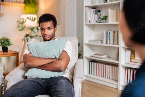 Young man unhappy during therapy