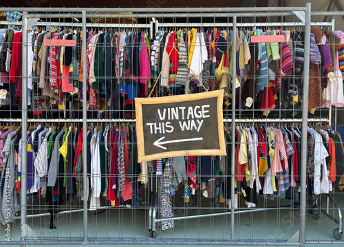racks with vintage clothes photo