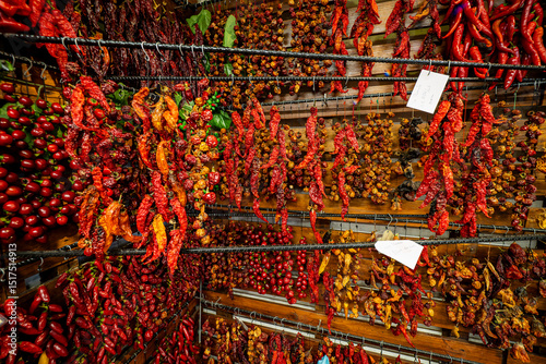 Great view of thousands of threaded chili peppers hanging from a wall at the Mercado dos Lavradores (farmer's market) in Funchal, Madeira, Portugal