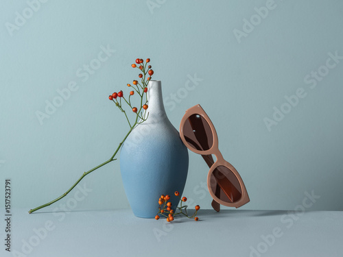 Minimalist Still Life with Blue Vase and Sunglasses photo
