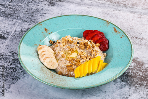Fototapeta Naklejka Na Ścianę i Meble -  Healthly oats porridge with fruits