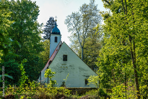 Church St.Clemens in Kranzberg near Freising, Bavaria with ancient graveyard and beautiful old wrought iron crosses photo