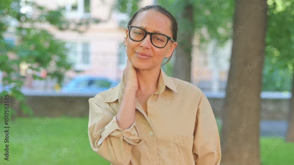 Tired Multi Ethnic Woman with Neck Pain Outdoors Tired Multi Ethnic Woman with Neck Pain Outdoors