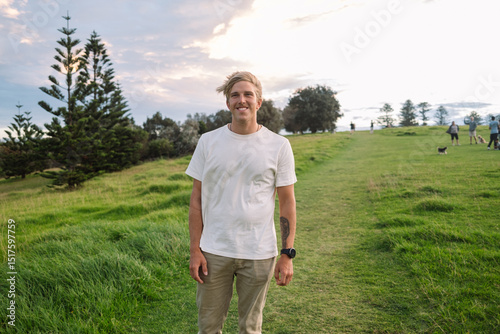 Portrait of a young man enjoying a  day surrounded by greenery