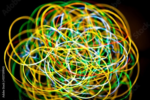 Colorful light streaks dance in the dark