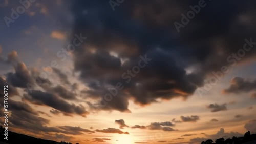 Dramatic Cloudscape with Sunlight Breaking Through at Sunset