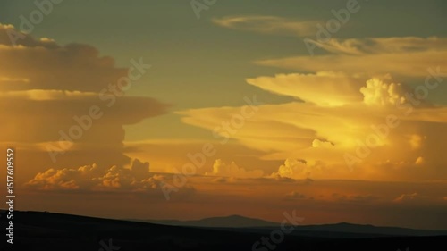 Dramatic Cloudscape with Sunlight Breaking Through at Sunset