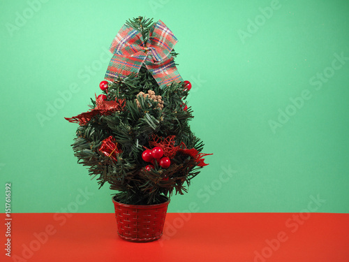 christmas tree over green and red background