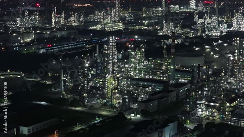 Night Aerial View of China's Massive Petrochemical Complex in Ningbo Zhenhai Refining and Chemical, Towering Chimney Emitting Flue Gas under Starry Sky