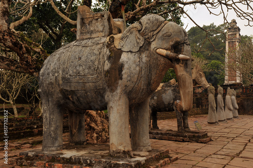 A stone statue of an elephant and horse at the tomb of Emperor Tu Duc, near Hue, Vietnam. 