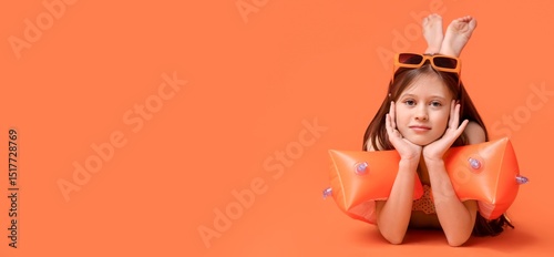 Cute little girl in swimsui...