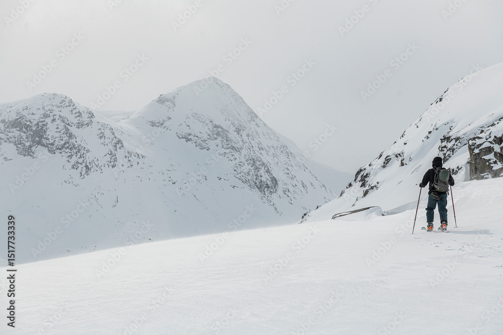 Explorer looking at snowcapped mountains against sky Explorer looking at snowcapped mountains against sky