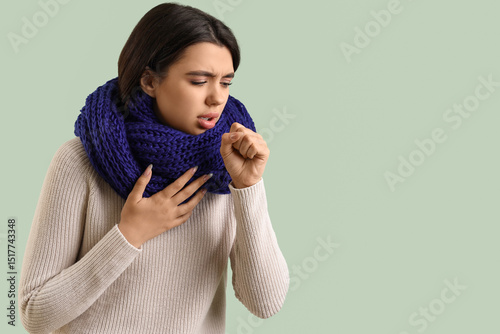 Sick coughing young woman o...