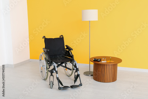 Empty wheelchair with lamp ...