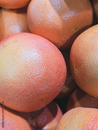 fresh ripe grapefruits as a vibrant citrus background