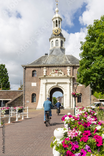 People passing the city gate Zijlpoort in to the old center of Leiden in South-Holland The Netherlands