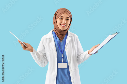 Female Muslim doctor with c...