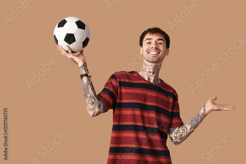 Happy young man with soccer...