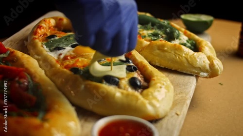 I put the cheese in the shape of a ship's canvas on my feet. Vegetarian pide pide with egg and pide with salami. 4k video
