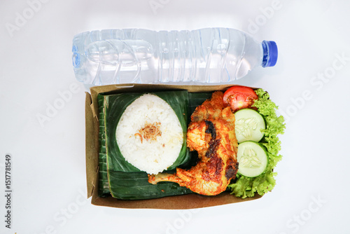 Nasi Ayam Bakar is a Javanese food made from grilled chicken with rice and mineral water