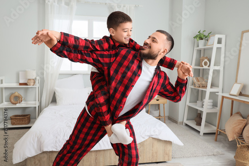 Happy father and son playin...